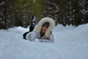 Girl in the winter frosty forest