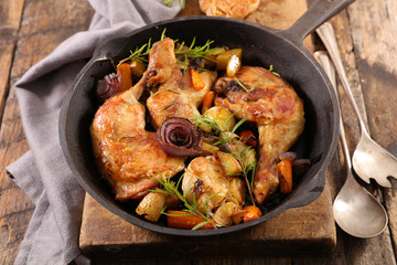 grilled chicken leg with vegetable in pan