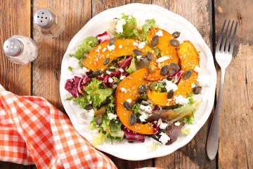 vegetable salad with roasted pumpkin slices, cheese and lettuce