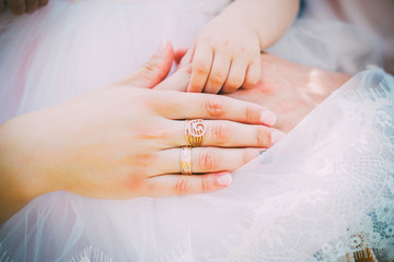 Couple With Pregnant Woman Relaxing On Sofa Together