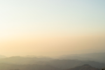 Layers of mountain with mist and warm sunlight.