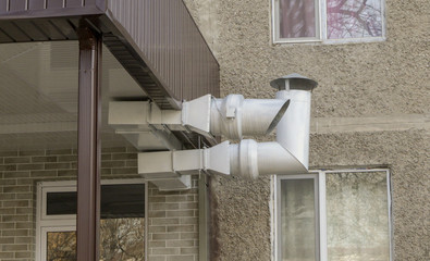 Chimney from the boiler mounted on the front wall of the facade and carried out under a canopy