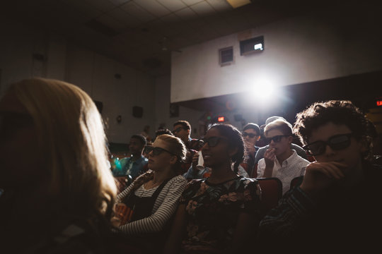 Tween Friends In 3d Glasses Watching Movie In Dark Movie Theater