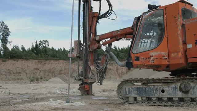 Drilling rig making blast holes in quarry