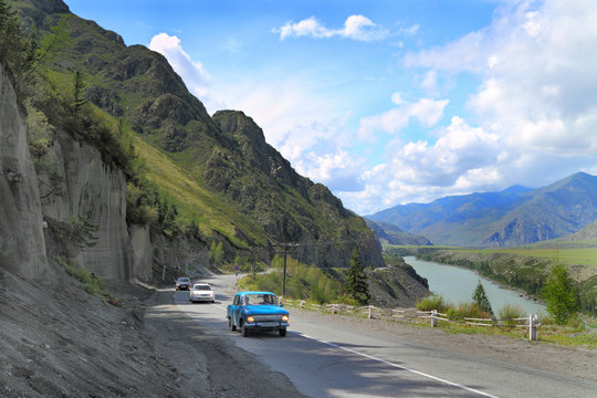 Landscape with road and river Katun in the Altai Mountains in Russia