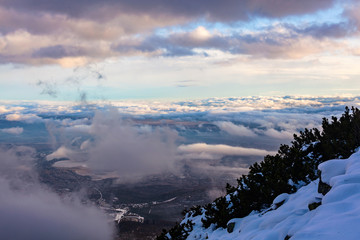 Fototapeta na wymiar View of the High Tatras with fog and snow