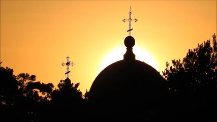 Silhouette of an Eastern Orthodox Church on a Sunrise Cloud Sky