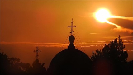 Silhouette of an Eastern Orthodox Church on a Sunrise Cloud Sky
