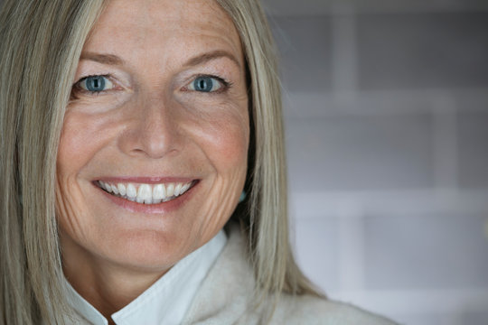 Close up portrait, smiling mature woman