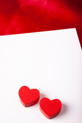 Red heart with white card. Love and Valentines concept.