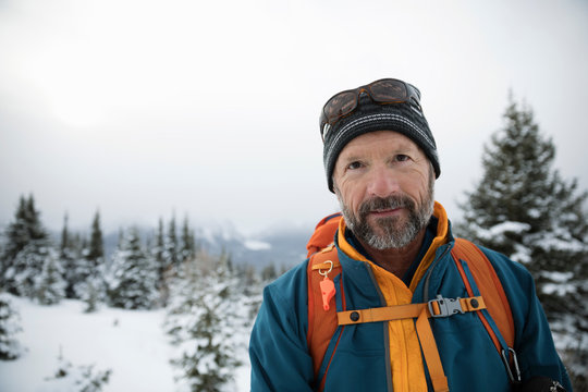 Portrait Confident Active Senior Man Skiing In Snow