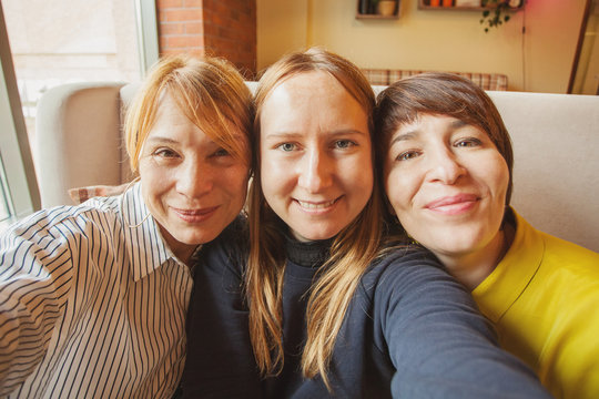 Happy women taking selfie photo