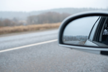 Car trip and responsible travel concept. Road with forest. Banner with copyspace. Background for designer. Stock photo.