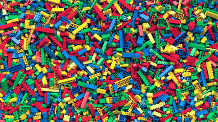 Lot of various colored toy bricks background