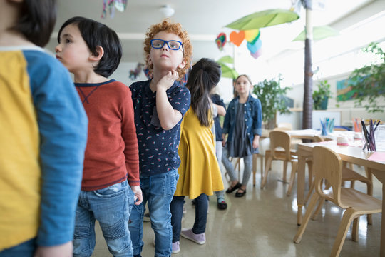 Preschool students lining up in classroom