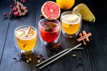 Mulled wine and mulled cider. Hot winter drinks and cocktails for christmas or new year's eve in glass mugs