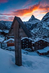 Zermatt and Matterhorn in the Alps of Switzerland on a wonderful sunset with a cross