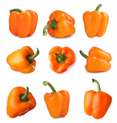 Set of ripe orange bell peppers on white background