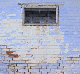 the brick is old painted and the paint