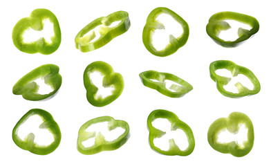 Set of cut ripe green bell peppers on white background