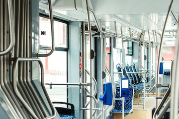 Modern city tram interior. Public transport and e tickets. Passenger transportation.