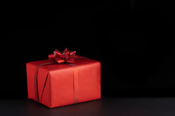 Valentine day concept. Red Christmas gift presents on black background. Greeeting card, postcard....