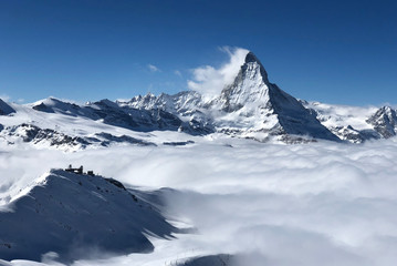Zermatt Matterhorn gornergrat emerging from sea of clouds view perfect sky