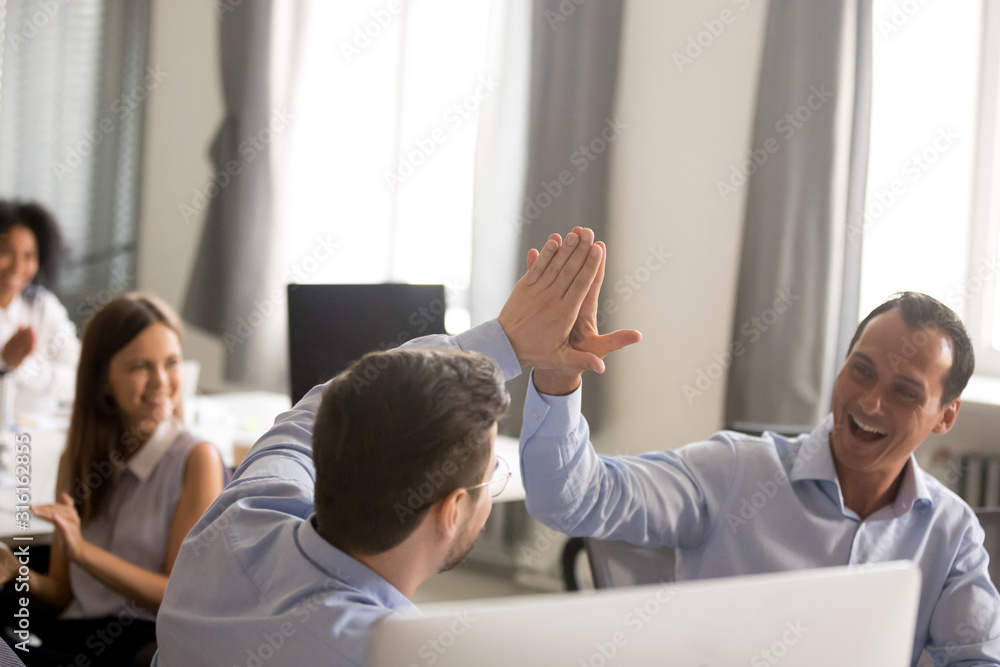 Sticker Excited businessmen give high five celebrating shared success