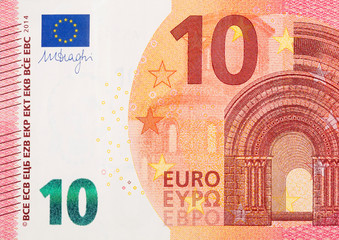 Fragment part of 10 euro banknote close-up with small red details