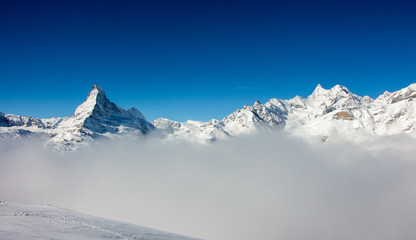 Fototapeta na wymiar Zermatt Matterhorn view mountain winter snow landscape sea of fog clouds sunset