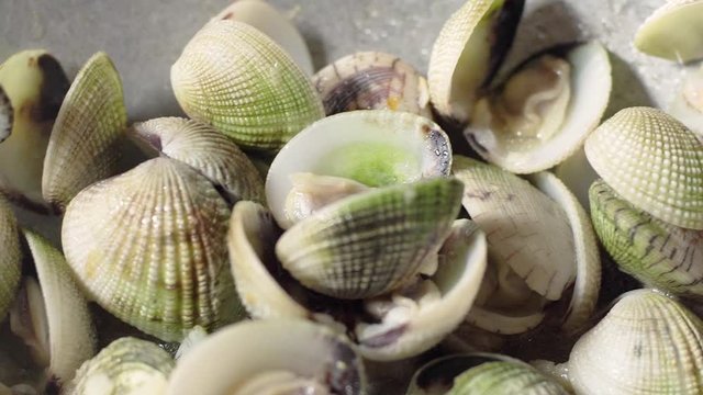 Close Up Stir Fried Quahaug Shell with Garlic in Frying Pan, Shell Open that Ready to Eat 