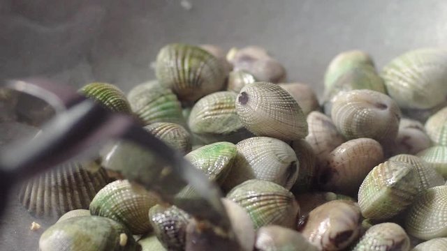 Adding Quahaug Shell to Hot Frying Pan Mix and Stir Fried with Garlic 