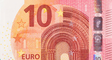 Fragment part of 10 euro banknote close-up with small red details - obrazy, fototapety, plakaty