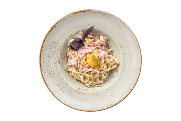 Spaghetti Carbonara with egg yolk isolated on white background