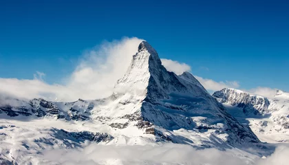 Foto op Canvas Zermatt Matterhorn en gletsjer uitzicht berg winter sneeuw landschap wolken © Andreas