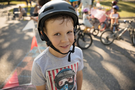 Portrait smiling boy wearing bike helmet