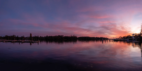 Obraz premium Reflection on a lake during colorful sunset, stock image, Potsdam, Germany