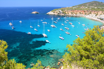 Cala d'Hort bay with beach and turquoise water on Ibiza