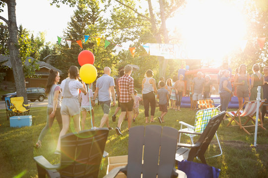 Neighbors Enjoying Summer Neighborhood Block Party In Sunny Park