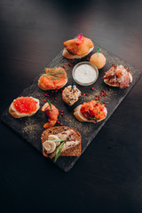 black plate with different bruschettas