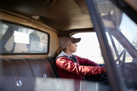 Female Farmer Driving Truck