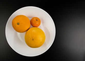 Juicy fruits lie on a plate
