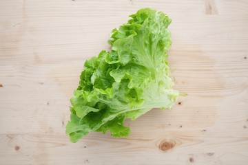 Lettuce on a wooden background.