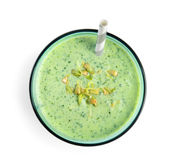 Glass of green buckwheat smoothie isolated on white, top view
