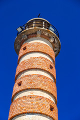 Belem red brick lighthouse on a summer day with a deep blue sky