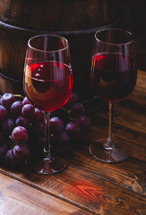 Two Glasses of Red Wine and Grapes