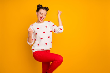 Fototapeta na wymiar Photo of beautiful cupid lady raise fists celebrating romantic date invitation scream loudly wear hearts pattern white sweater red pants isolated yellow color background