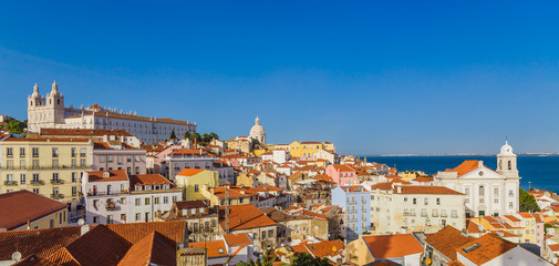 Fototapeta na wymiar Panoramic view of Lisbon from the terrace from the Portas Do Sol belvedere in the Alfama district in Lisbon, Portugal