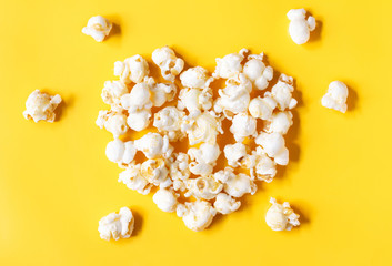 popcorn blast heart shape with corn on yellow isolated