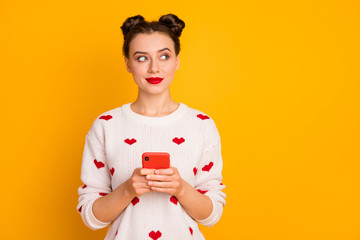 Fototapeta na wymiar Portrait of her she nice attractive lovely pretty cute glamorous cheerful curious girl using cell creating smm strategy isolated over bright vivid shine vibrant yellow color background